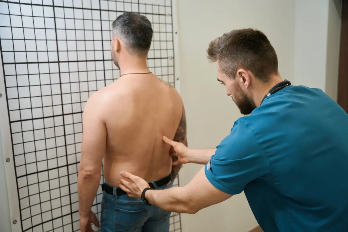 experienced physio conducting spinal examination